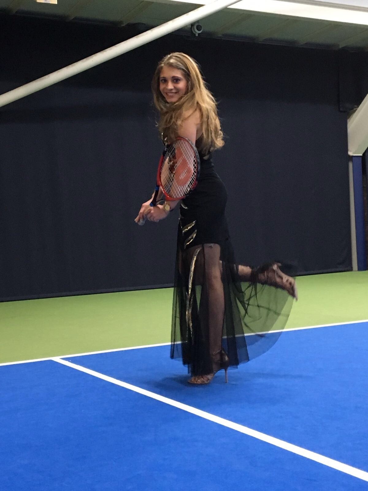 Sabrina on a tennis court
